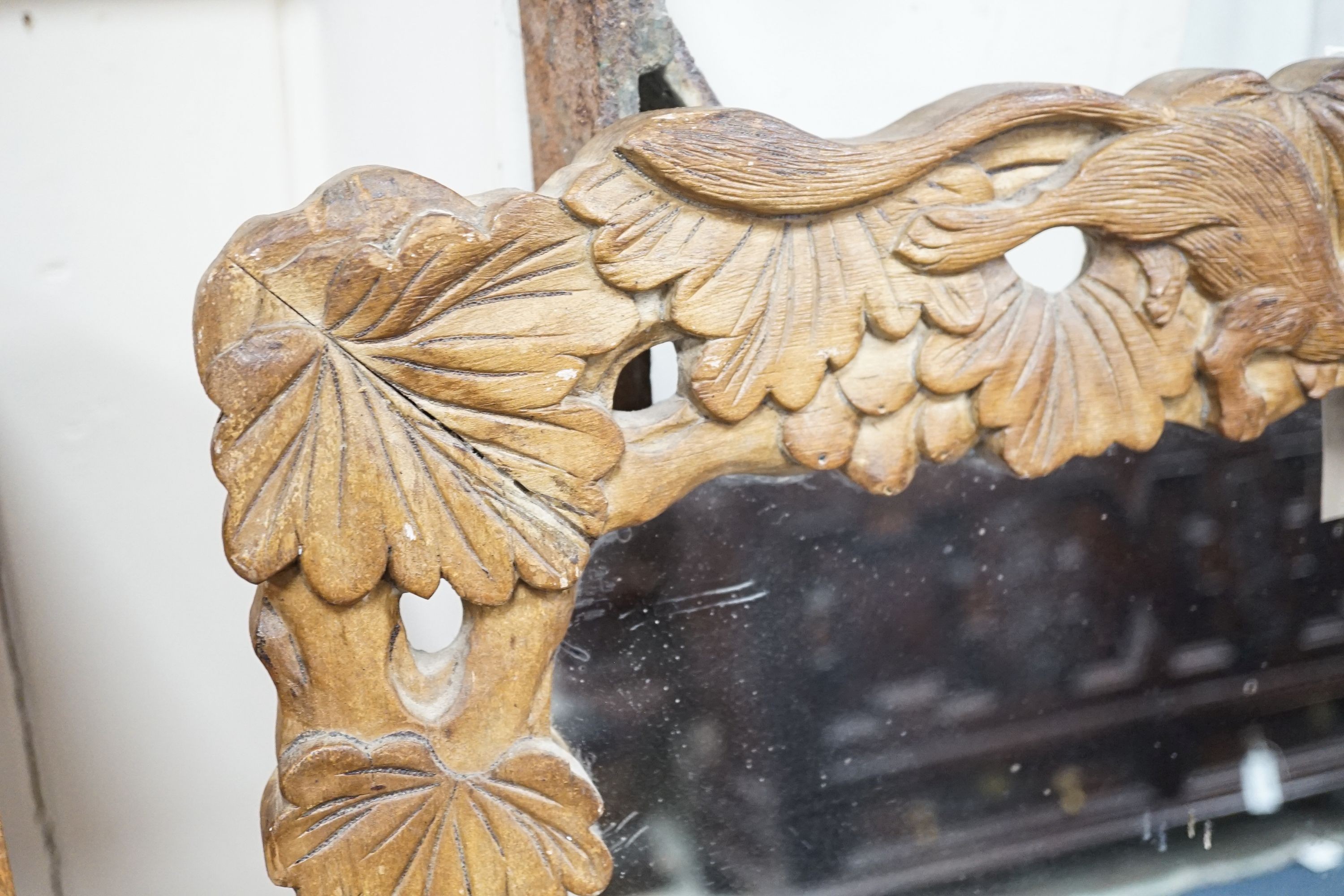 A Japanese 'squirrel and vine' rectangular carved wood mirror, width 57cm, height 96cm